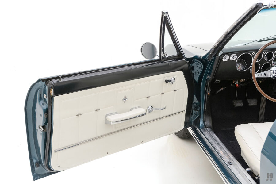 driver's side door of old chevrolet corvair convertible automobile for sale at hyman dealers