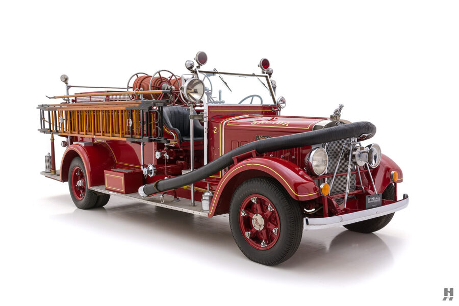 angled side view of mack fire truck for sale at hyman classic car dealership