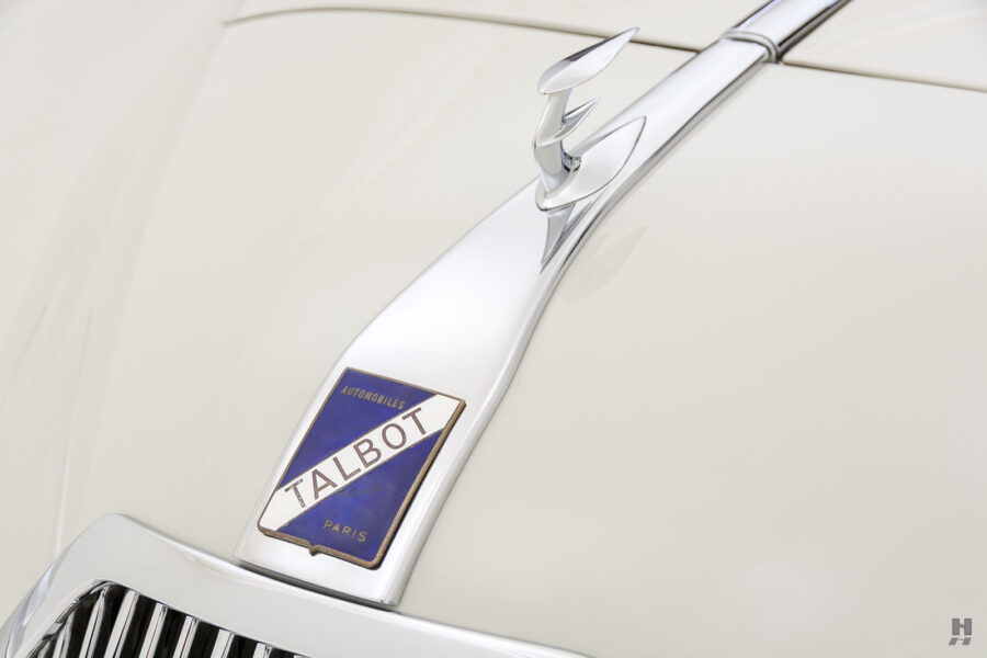 logo and metal piece of old talbot coupe for sale at hyman classic car dealership